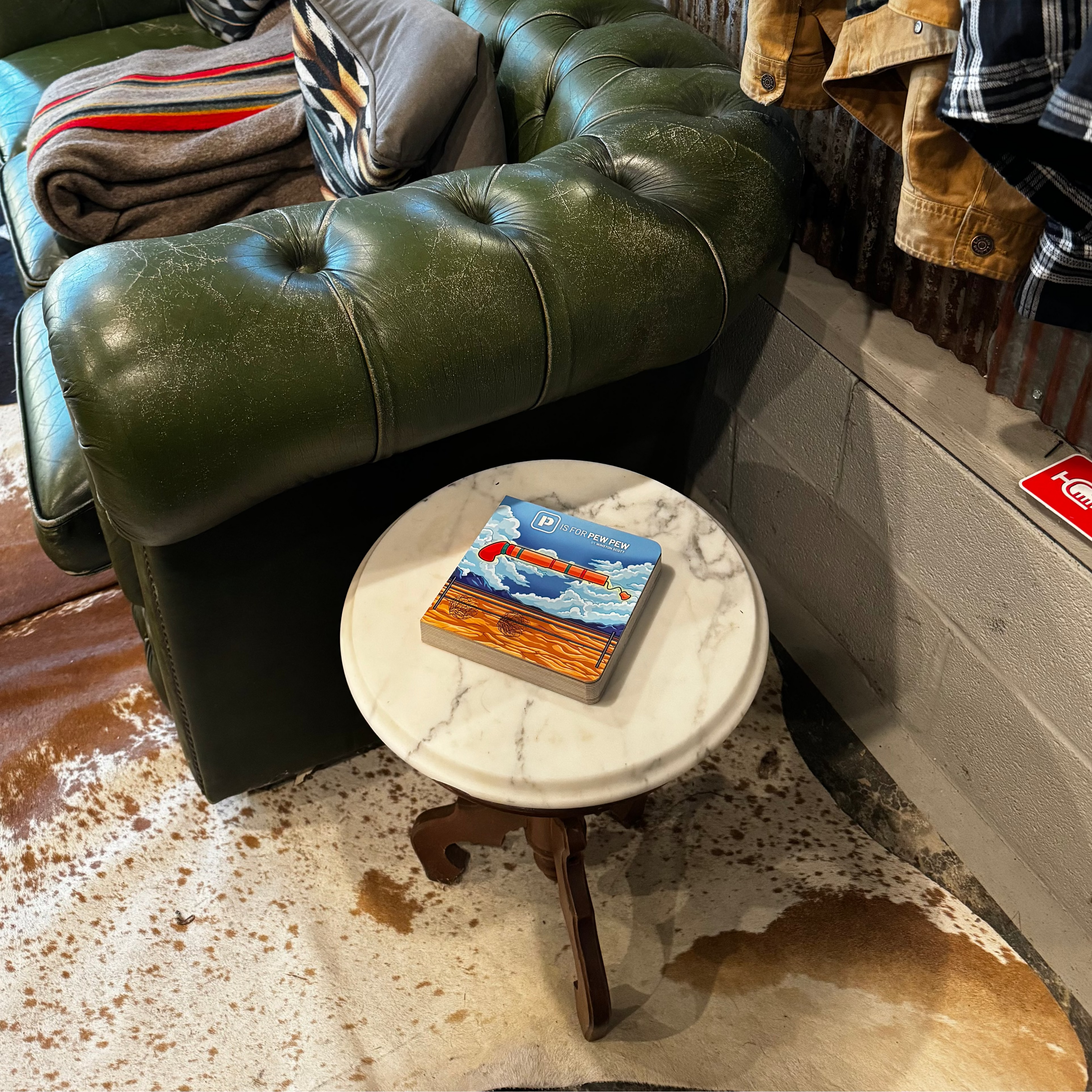 P is for Pew Pew on coffee table